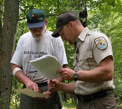 Two Wildlife Workers discussing Eagles